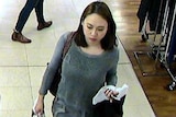 25 year old Mengmei Leng walking through a shopping mall in Pitt Street Sydney