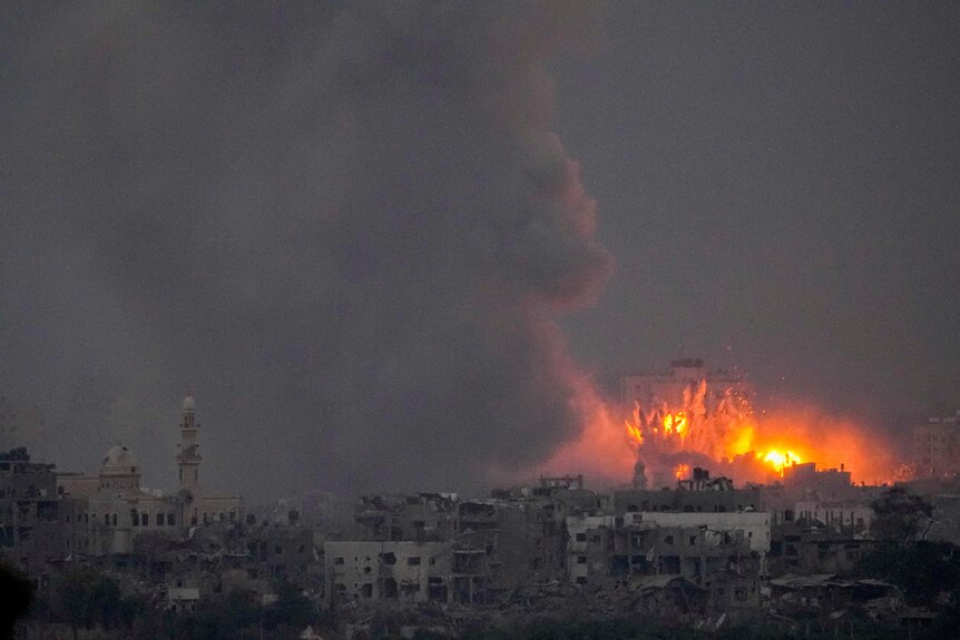 Smoke and fire rise following an Israeli airstrike in the Gaza Strip.