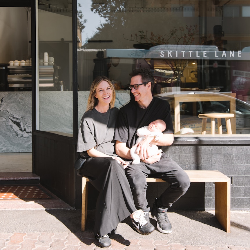 Jodie Foster and Dean Wooding sit outside their cafe at Bondi.