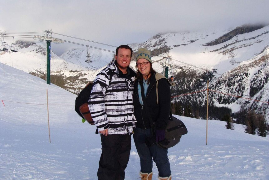 Toowoomba couple Grant and Beth McEwan hugs on a holiday in the snow