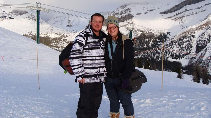 Toowoomba couple Grant and Beth McEwan hugs on a holiday in the snow