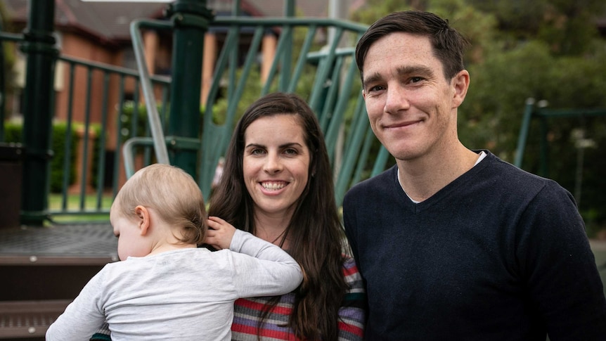 A young couple with a small child.