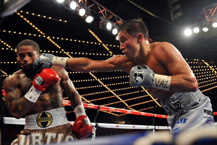 Kazakh boxer Gennady Golovkin connects with a right hand on Curtis Stevens, warping his face