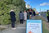 A line of people at the Trarlagon COVID vaccination clinic
