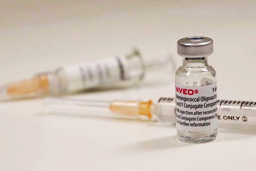 Two syringes and a small vial of vaccine.