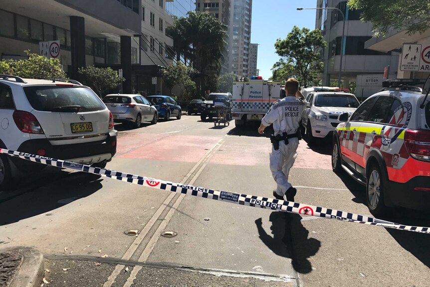 Police tape and vehicles on Brown Street, Chatswood.