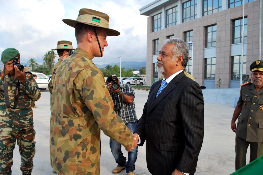 East Timor Prime Minister Xanana Gusmao, right, farewells Australian troops in Dili.