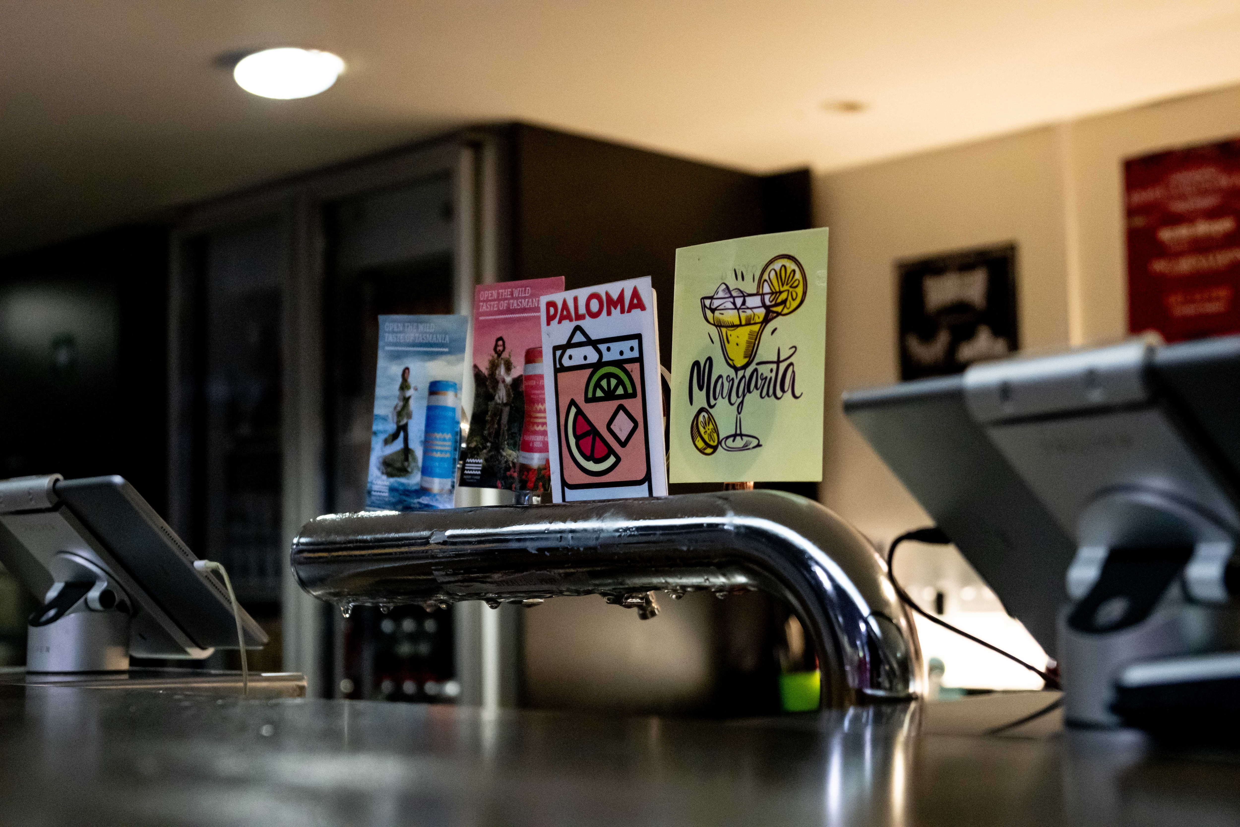 Bar interior with music poster on wall