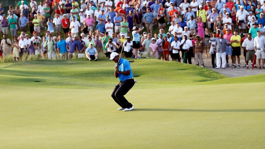 Tiger Woods reacts after missing a putt on the 18th green at the Ocean Course in Kiawah Island.
