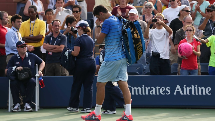 Australia's Bernard Tomic walks off court after his second round loss to Dan Evans at the US Open.