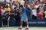 Australia's Bernard Tomic walks off court after his second round loss to Dan Evans at the US Open.