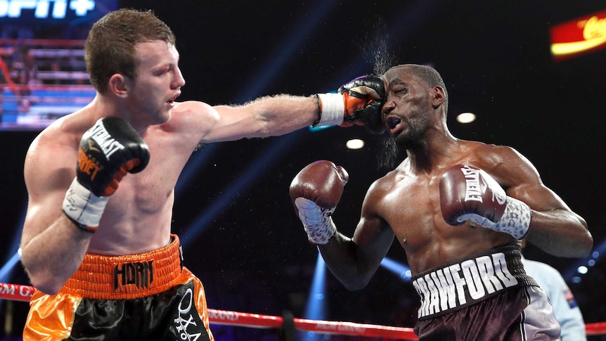 Jeff Horn plants a fist into Terence Crawford's face