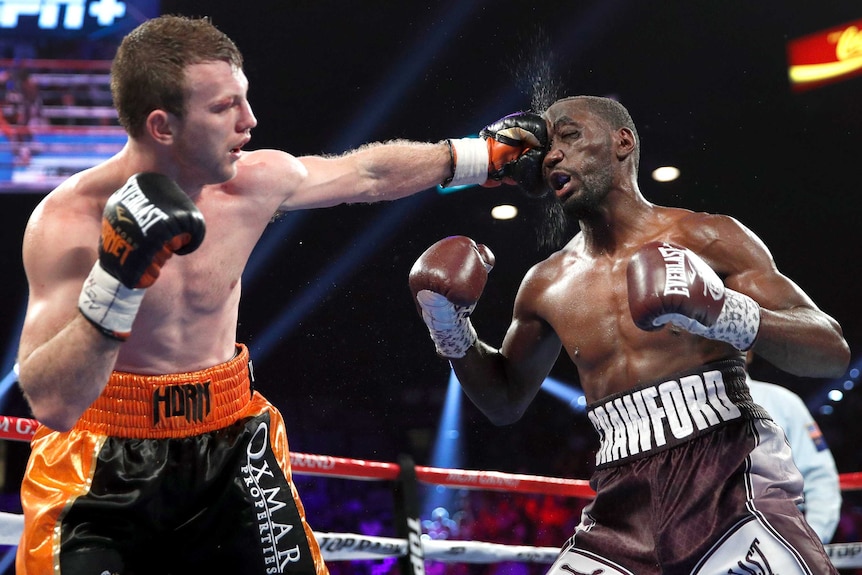 Jeff Horn plants a fist into Terence Crawford's face