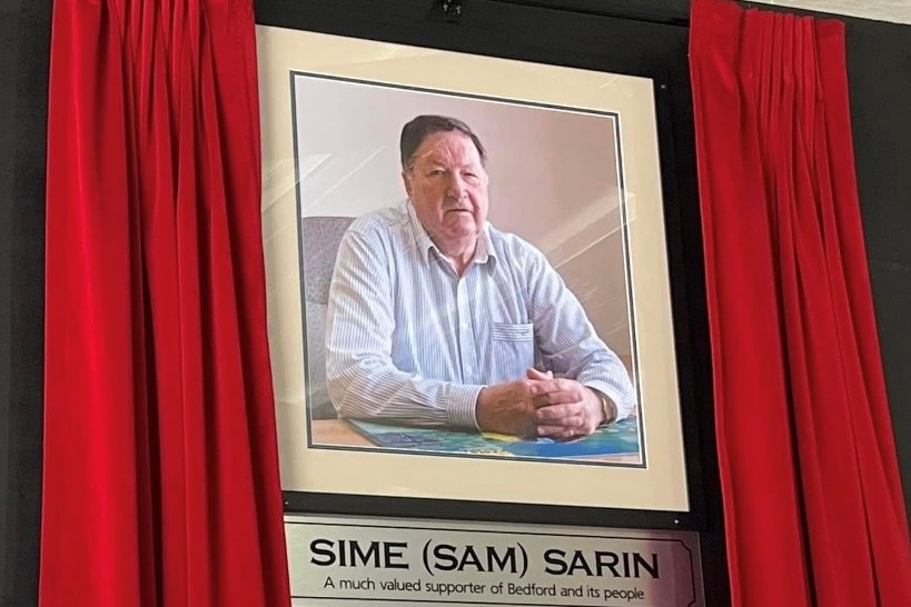 a photo frame of an older-aged man 