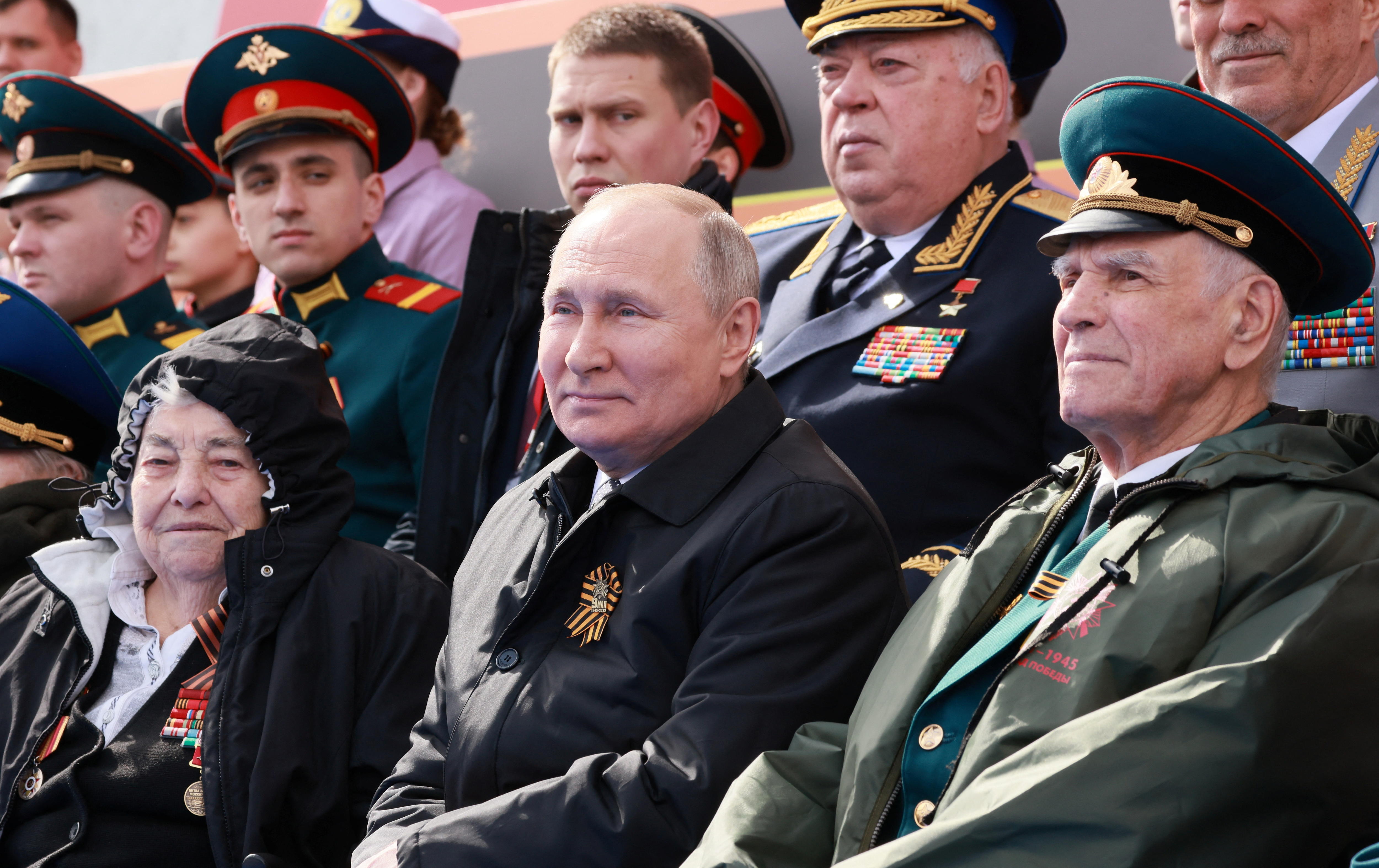 Russian President Vladimir Putin watches a military parade on Victory Day