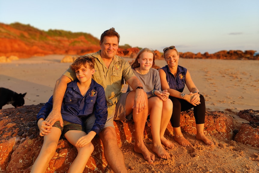 James Weeding and Jen Bird sit at beach in Broome