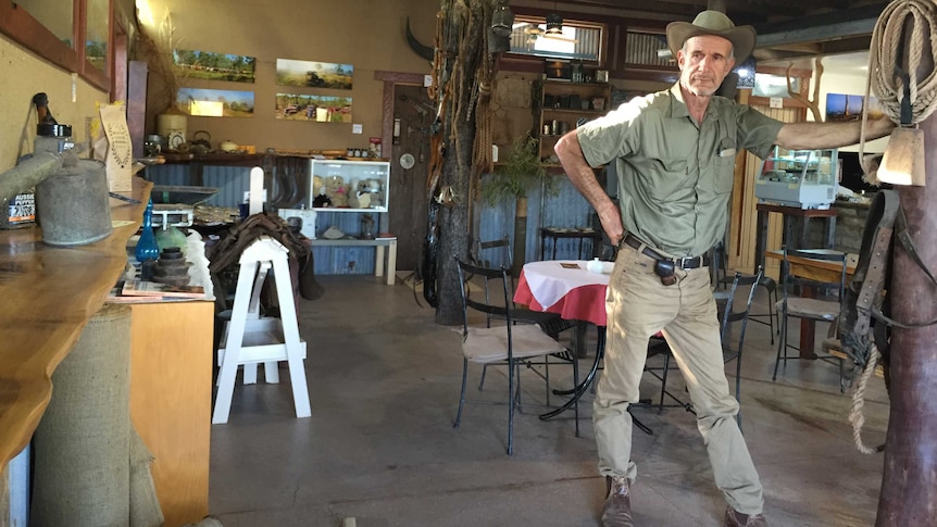 Outback adventurer Owen Davies surrounded by memorabilia in the coffee shop he created from an old butcher's shop