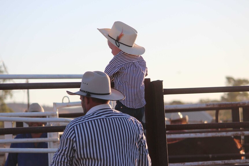 A young spectator watches the rodeo at Carrieton.