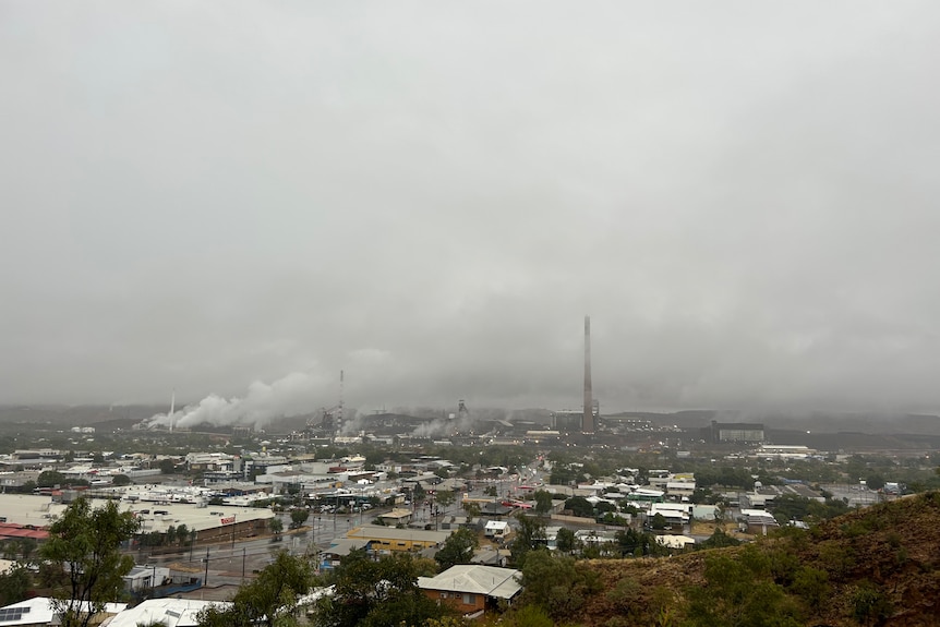 Clouds sit low over the town of Mount Isa, covering it's famous mining stacks from view. 