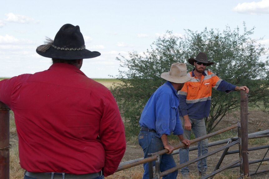 Colin Burnett receives help rebuilding fencing on his property north of Julia Creek in North West Queensland.