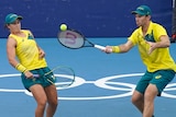 Australian tennis player Ash Barty sways out of the way of mixed doubles partner John Peers at the Tokyo Olympics.
