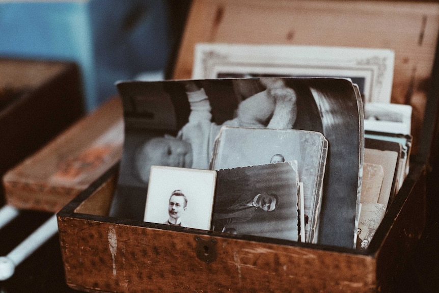 Old photographs in a box, something that can help elderly people feel more at home in aged care facilities.