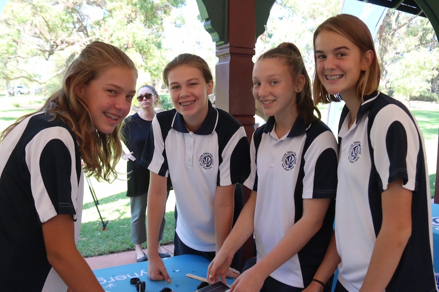 Students from Duncraig Senior High holding their cars