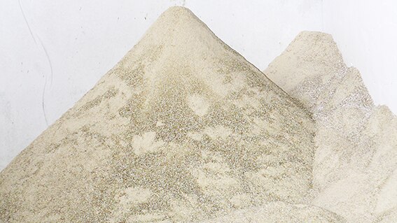 Sand created from crushed glass inside the Lismore glass processing plant