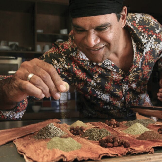 Man demonstrates the herbs and spices of Australian native ingredients