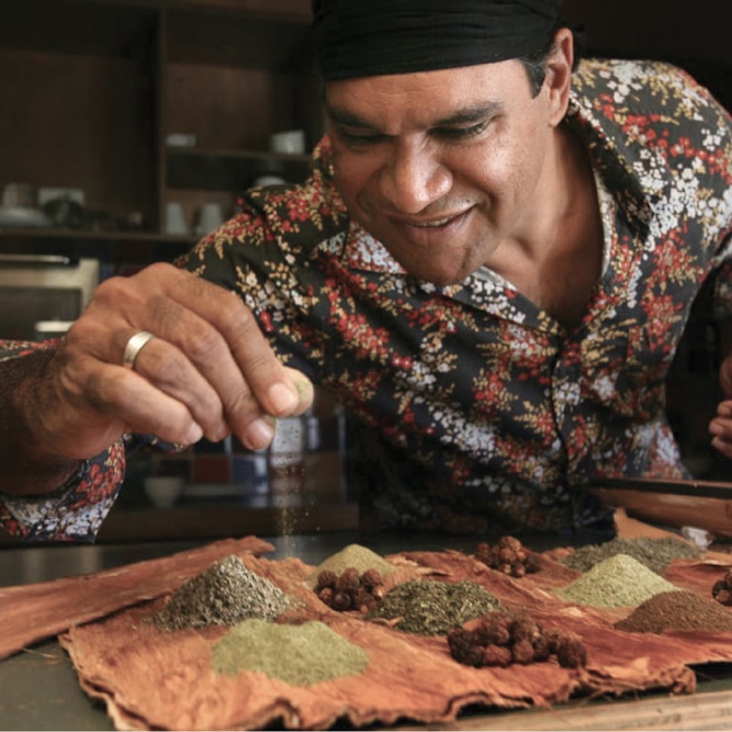 Man demonstrates the herbs and spices of Australian native ingredients
