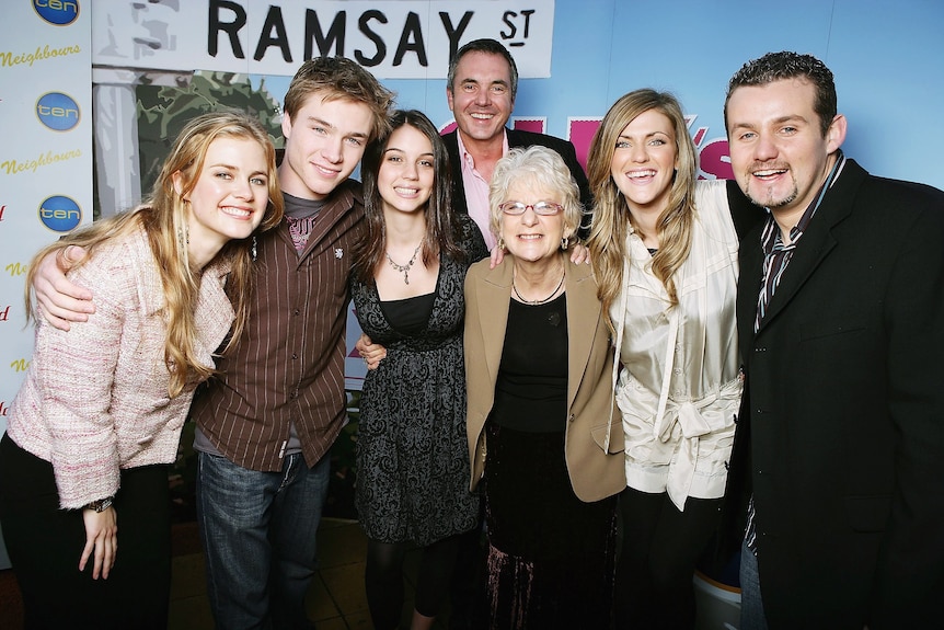 Cast and crew members of Neighbours pose together in 2006.