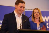 Liberal leader Alistair Coe and his wife speak at a party event.