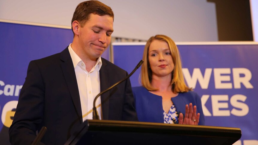 Liberal leader Alistair Coe and his wife speak at a party event.