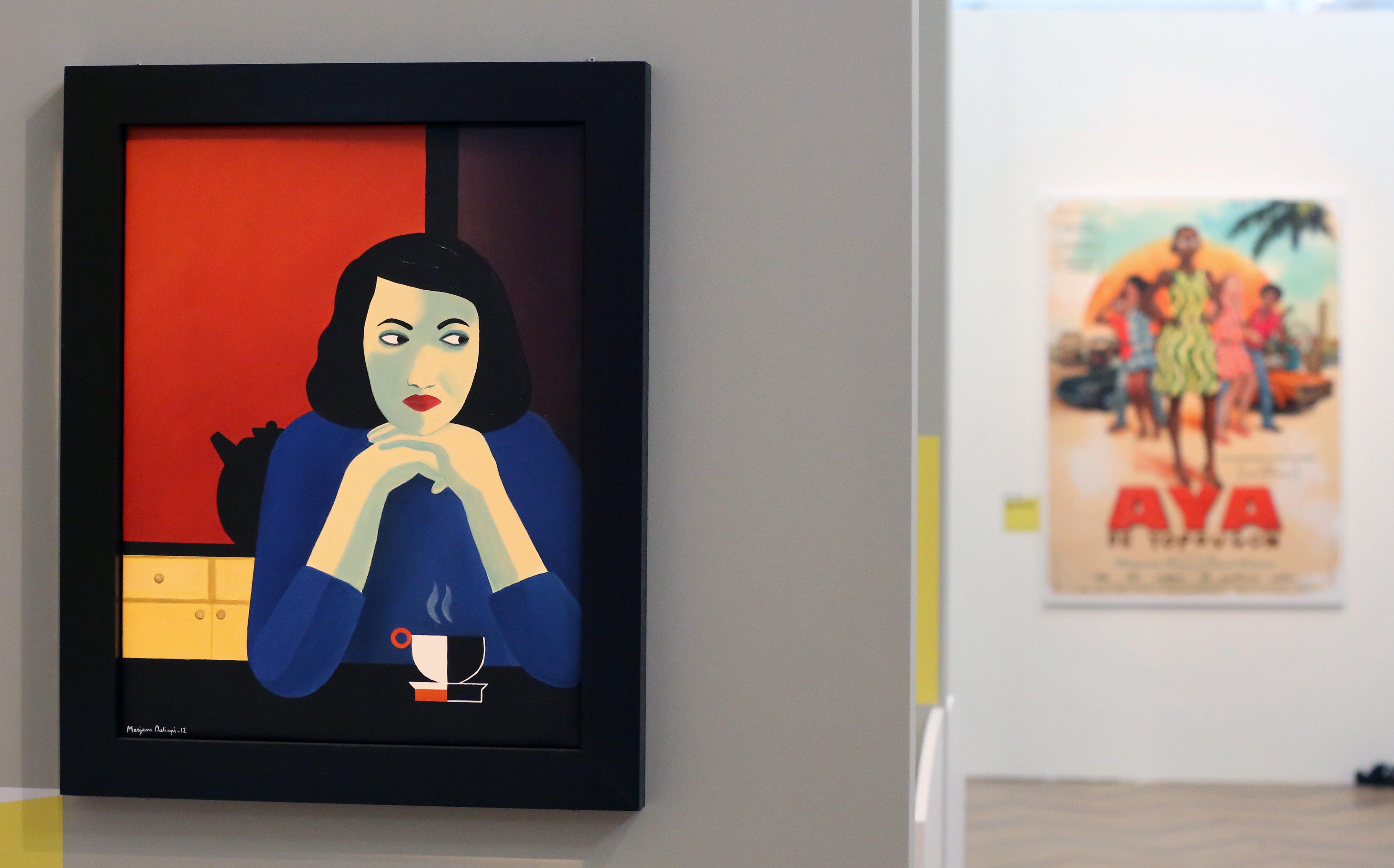 A painting showing a young woman side-eyeing out of frame while nursing a coffee is displayed on a gallery wall.