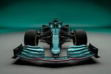 A driver-less Formula 1 car sits facing the camera in front of a metallic green background.