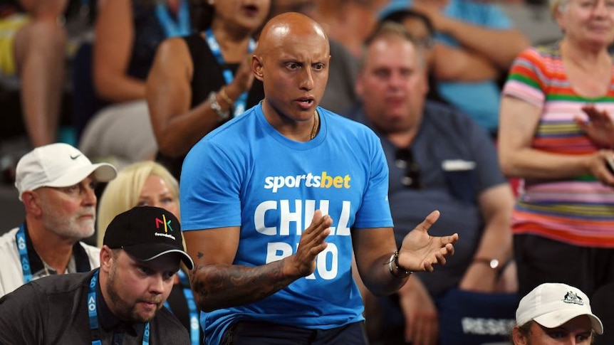 Christos Kyrgios wearing a SportsBet shirt at Nick Kyrgios Australian Open match