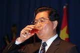 Chinese President Hu Jintao drinks from a wine glass, file photo