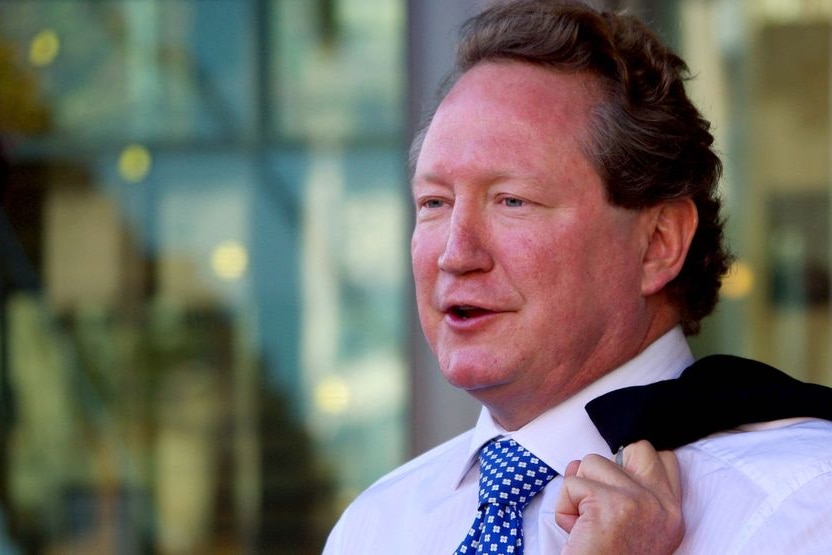 A head and shoulders shot of Andrew Forrest with his jacket slung over his shoulder.