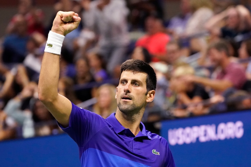 Novak Djokovic holds his fist in the air during a match against Jenson Brooksby at the US Open.