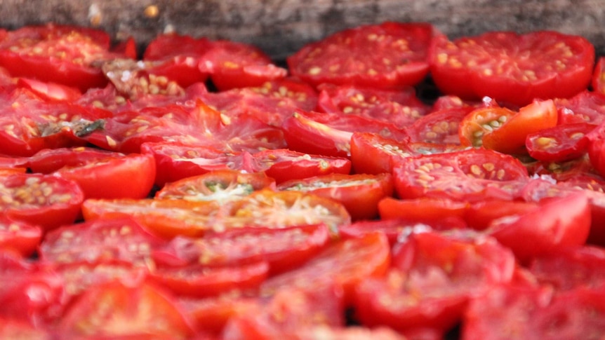 Sun-dried tomatoes being prepared.