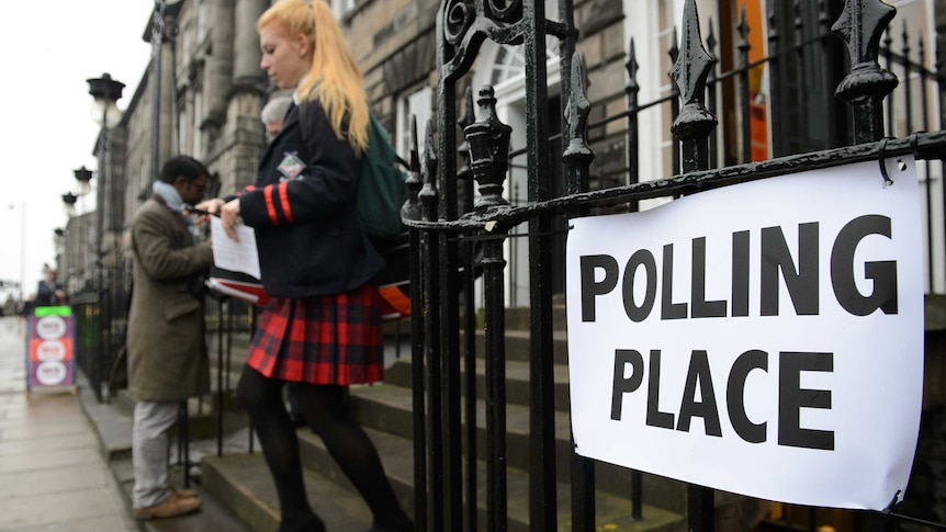 Young woman exits Scottish polls