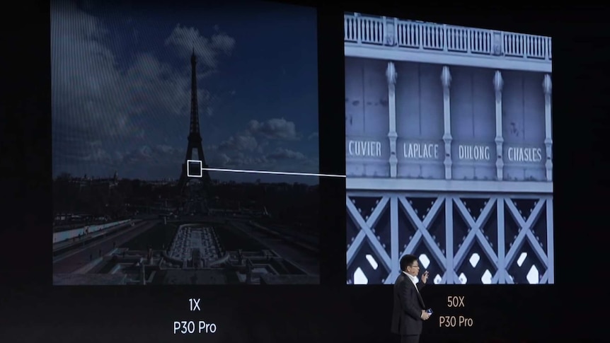 A demonstration of the Huawei P30 Pro's zooming capabilities reading writing on the side of the Eiffel Tower.
