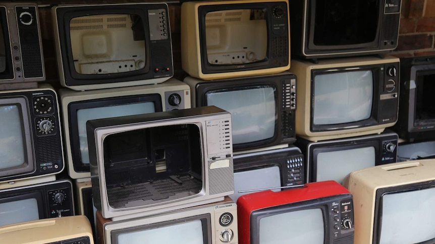 A collection of recycled analog TVs