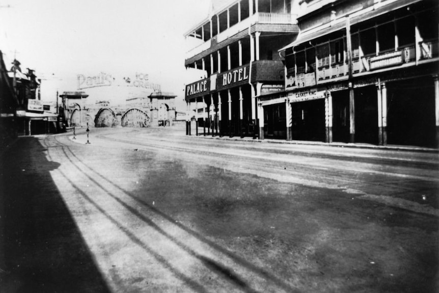 Historic black and white photo of the Palace Hotel and Victoria Bridge.