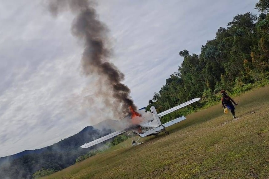 An image provided by Papuan rebels shows an aircraft from Susi Air on fire on an airstrip.