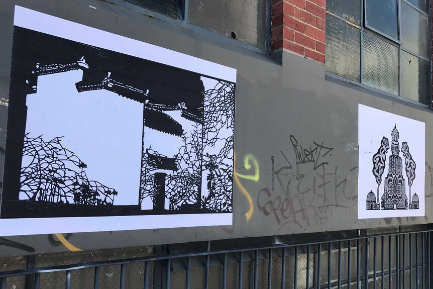 Philip Faulks and Zhou Bing artwork artworks next to graffiti on a Melbourne street