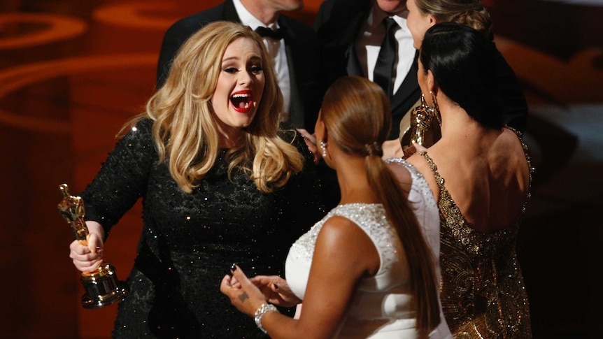 Adele accepts her Oscar