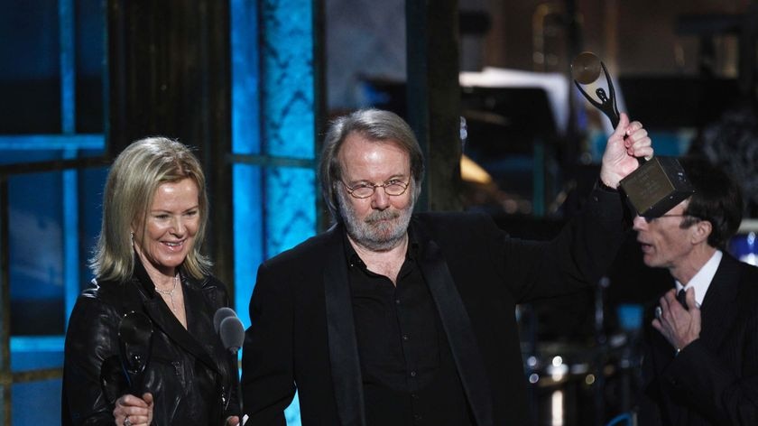 Anni-Frid Lyngstad and Benny Andersson of ABBA accept their awards