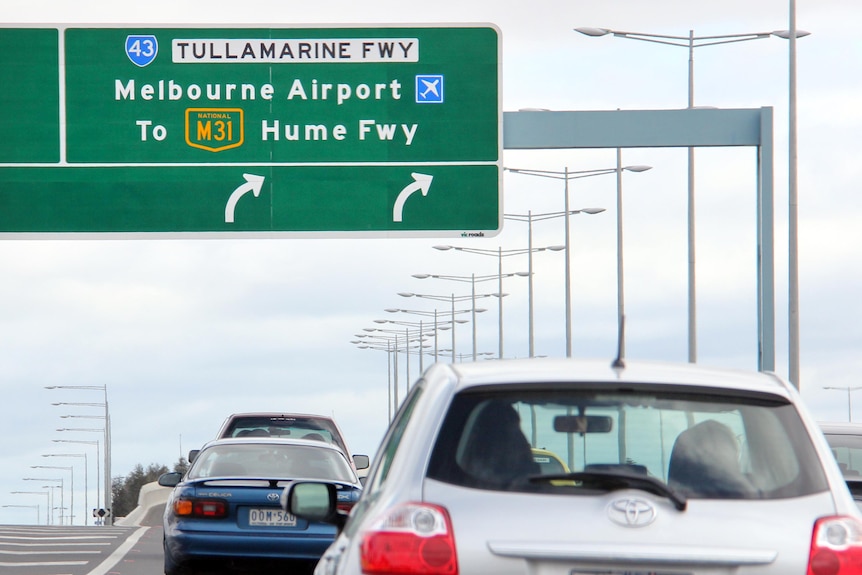 Cars move along the Tullamarine Freeway.