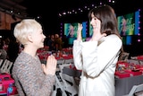 Michelle Williams and Anne Hathaway chat at the Independent Spirit awards